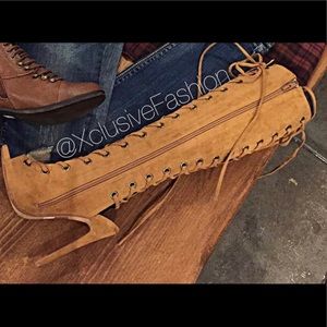 Faux Suede lace up high heel boot.